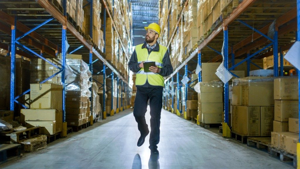 Manager inspecting the warehouse