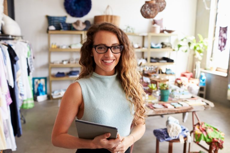 woman entrepreneur standing inside her store