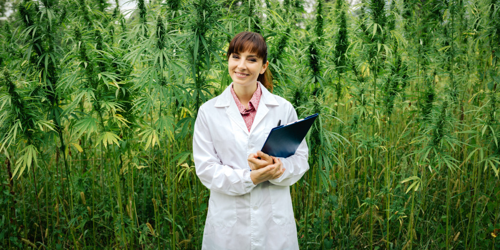 Scientist in front of plants