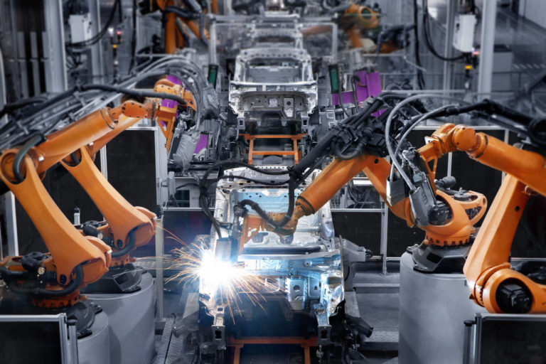 car manufacturing factory using mechanical tools to automate production